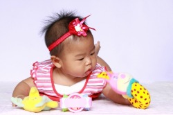 Baby Playing on Floor at Daycare