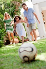 Children Playing Outside With Garage Door Open