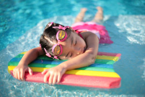 Optimized-Girl_with_styrofoam_swimming_board